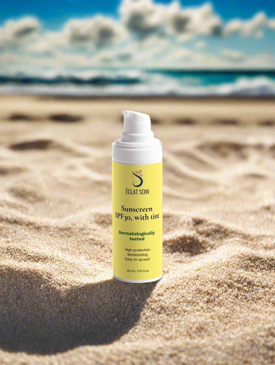 Eclat Soin Sunscreen SPF30 Sunscreen with Tint in a beach setting for sun protection and a natural glow